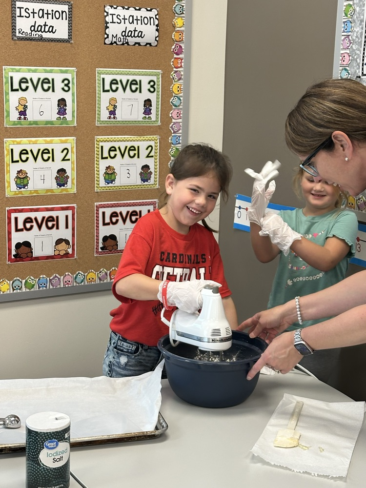 Adding ingredients to make cookies.