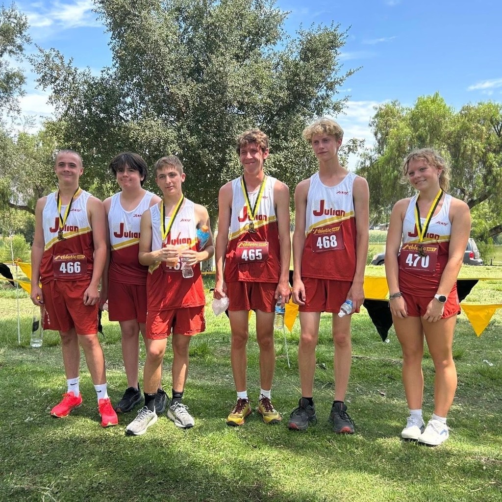 JHS Cross Country team poses for a pre-race photo.