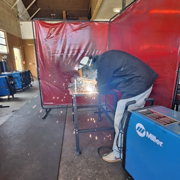 Student welds in the CTE Welding class.