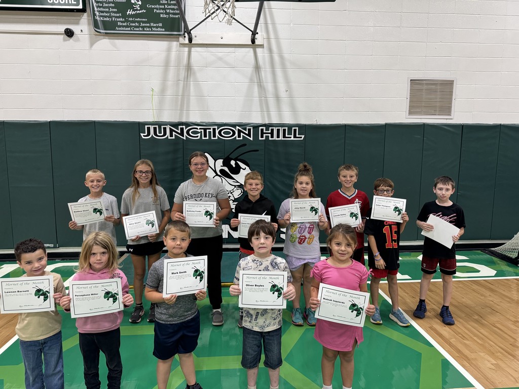 13 students pose with certificates for Hornet of the Month of October