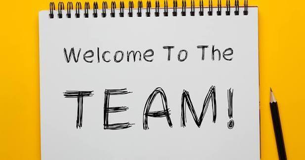 welcome to the team sign with a pencil on a notebook