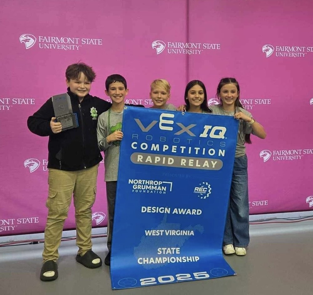 the coding corgis holding their award