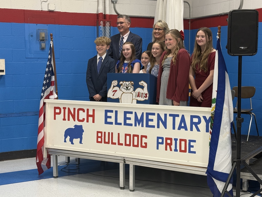 pinch elementary students taking a picture with dr. williams and school principal karen messinger