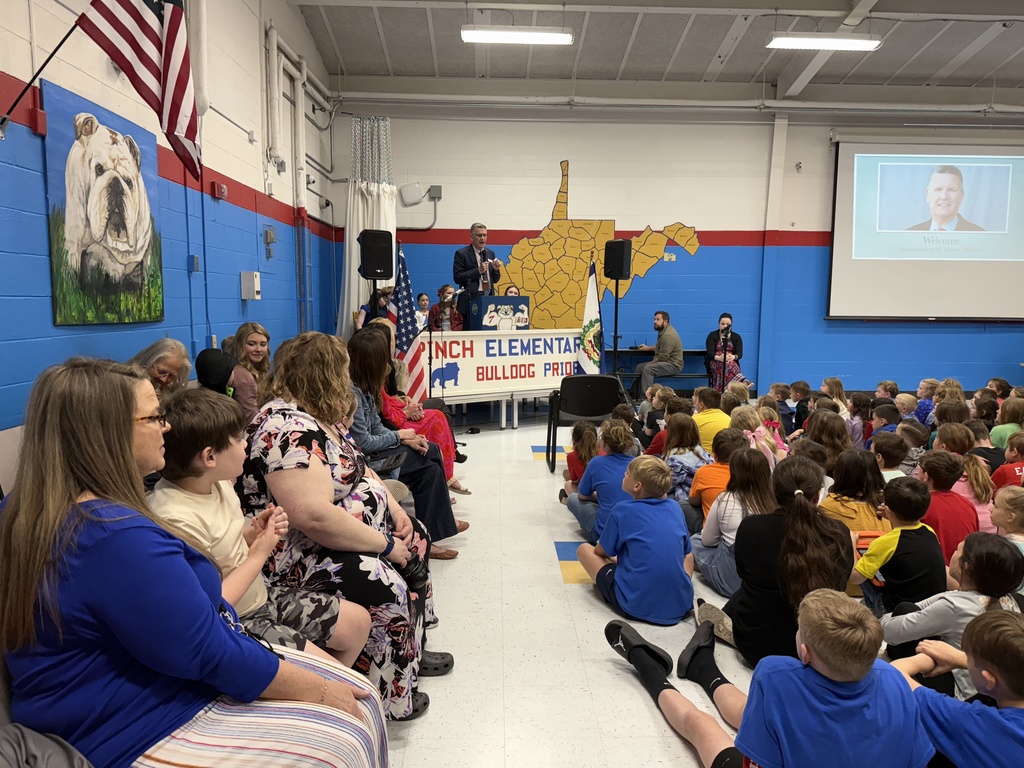 dr. tom williams speaking to students at pinch elementary during the school's annual leadership day event