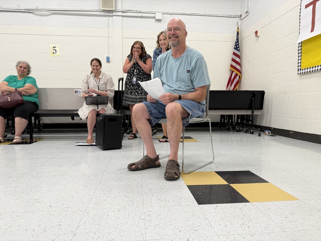 richmond elementary custodian norman dotson watching students perform a short skit congratulating him on being named kcs service person of the year.