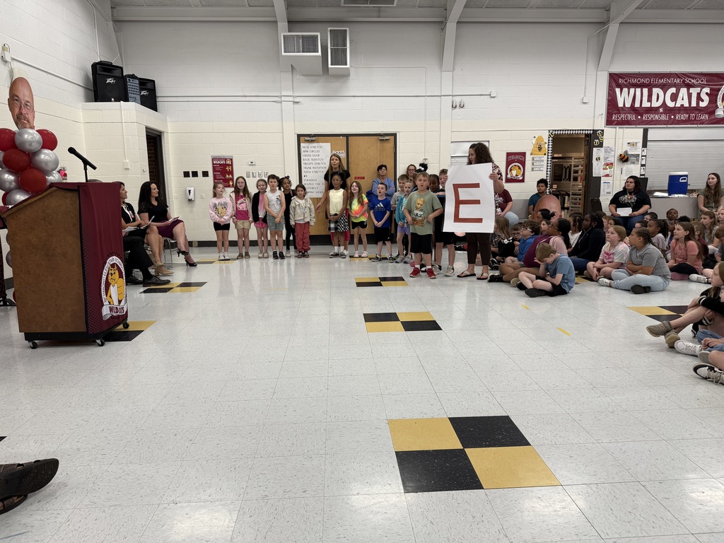 students preforming a skit during mr. norman's service person of the year celebration at richmond elementary.