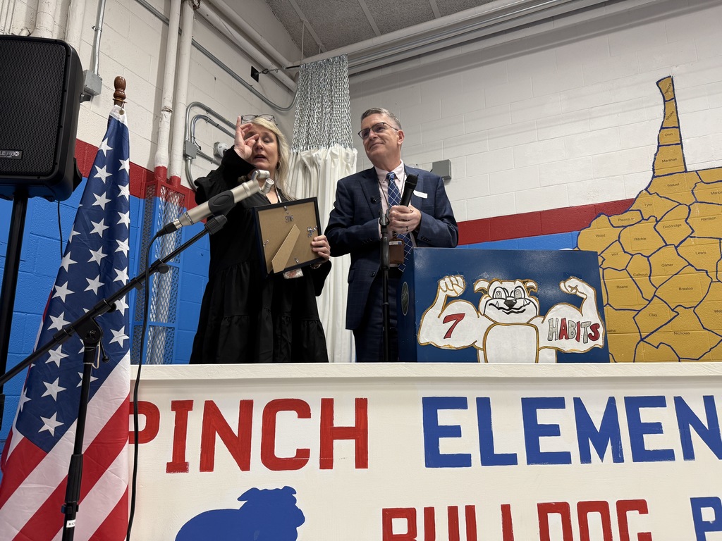 karen messinger wiping away tears after being announced as the kcs principal of the year.