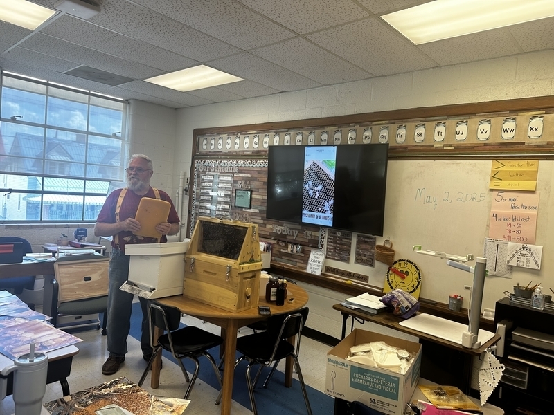 bee keeper speaking to belle elementary students during a lesson on bee keeping.