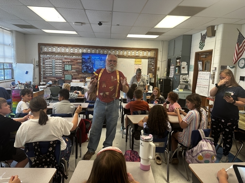 a local beekeeper talking to students in their classroom.