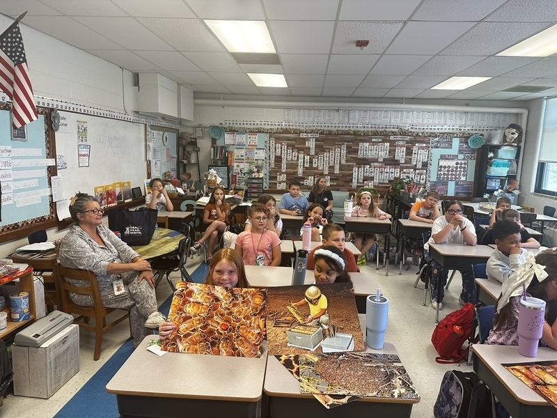 belle students showing off their bee placemats.