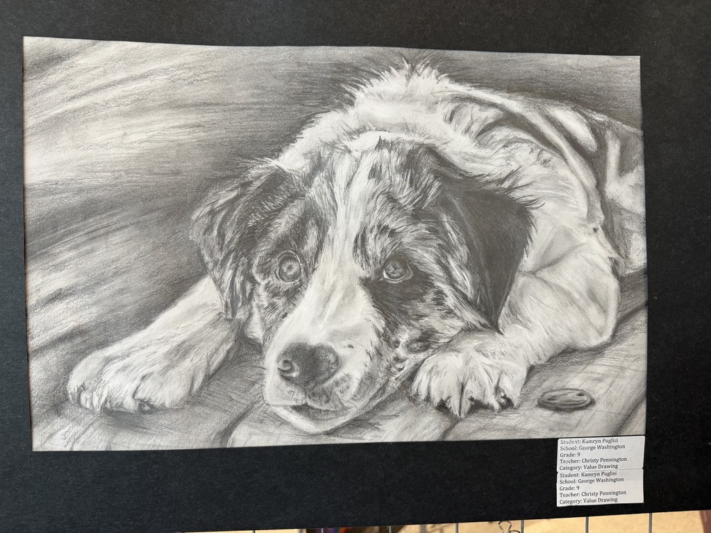 black and white drawing of a dog laying down