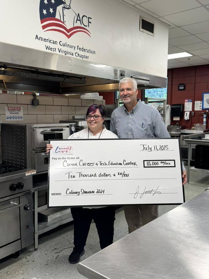 Photo of Chef Gum Accepting a $10K Check from the Charleston Coliseum & Convention Center