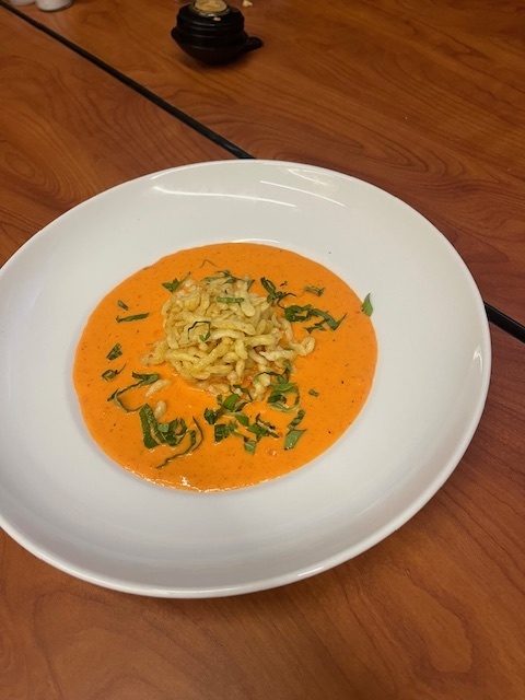 Roasted Red Pepper Coulis garnished with Green Onion & Spatzle