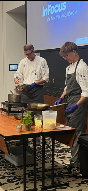 Chef Grant and Will Ellis doing a demo on preparing Roasted Red Pepper Coulis and Spatzle