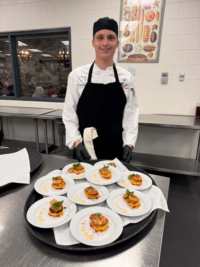 Zach preparing to serve