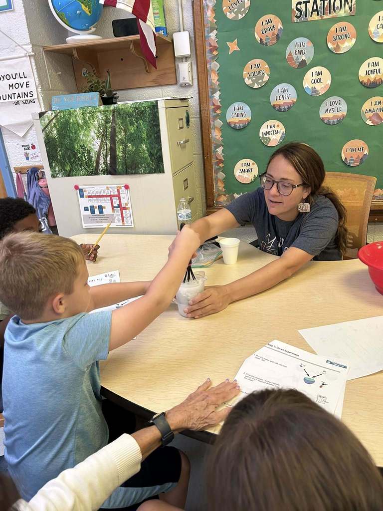 students at kanawha city elementary making their own playdoh during science class.