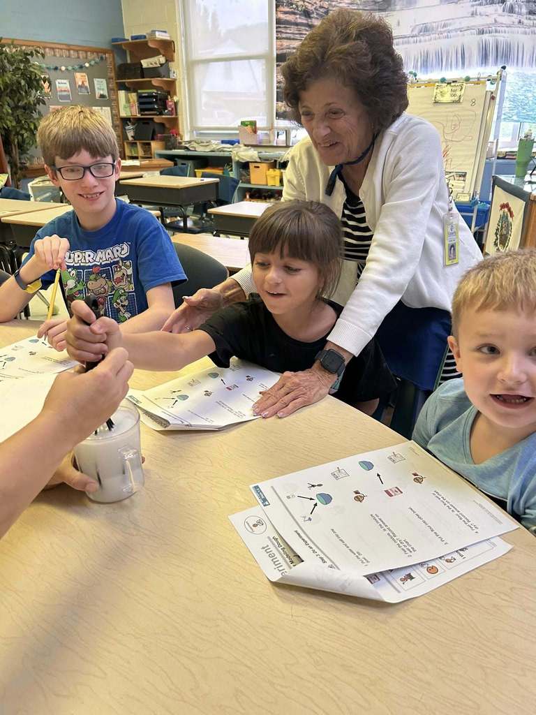 students at kanawha city elementary making their own playdoh during science class.