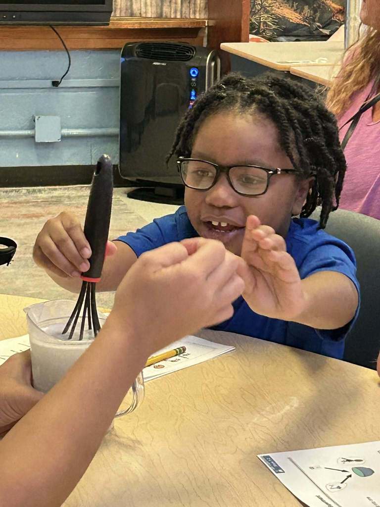 students at kanawha city elementary making their own playdoh during science class.