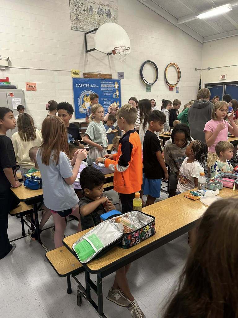 students talking in the lunchroom.
