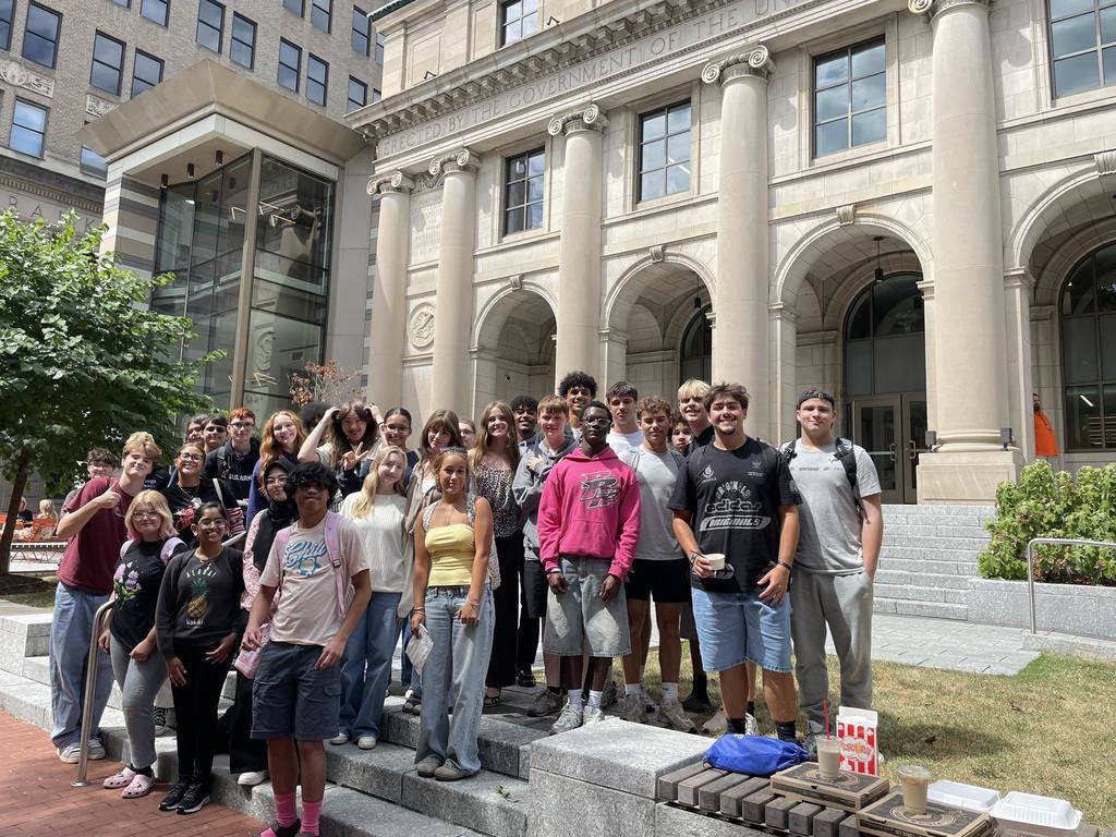 south charleston high school students posing outside of the kanawha county public library main branch in charleston.