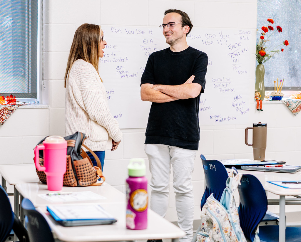 teachers in a meeting at herbert hoover high school learning new lessons to engage students. 