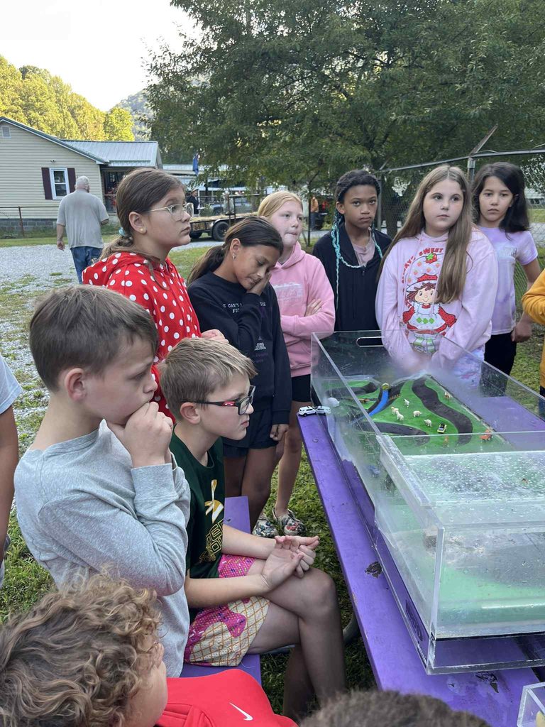 pratt students watching a water experiment.