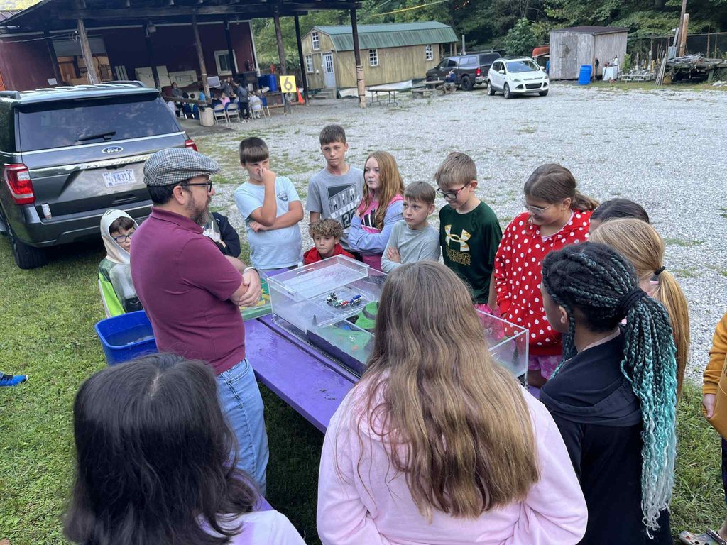 pratt students watching a water experiment.