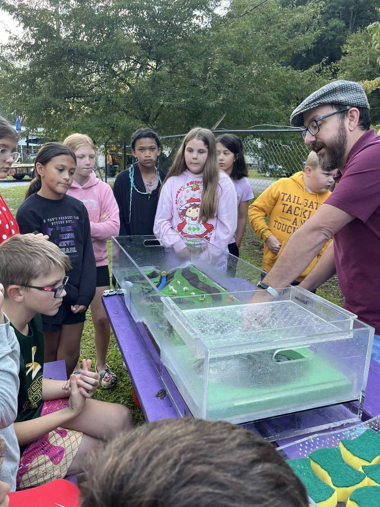 pratt students watching a water experiment.