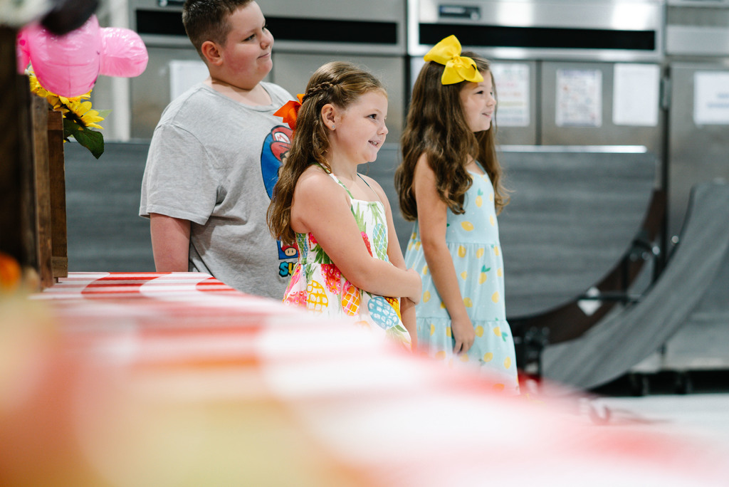 three malden students pose for a picture after picking fresh, wv grown food, at the school's farmers market event. 