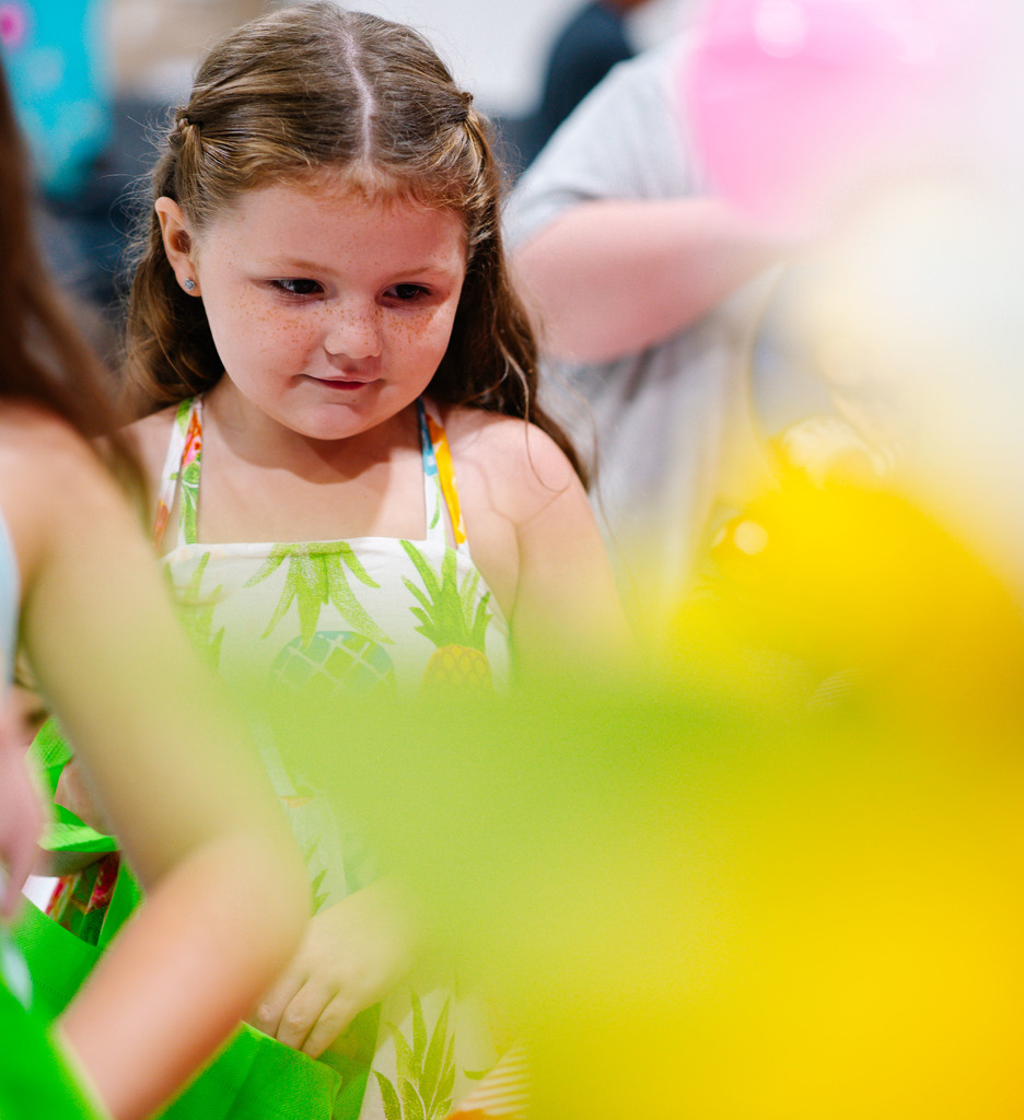 a girl in line at the farmers market event at malden elementary.