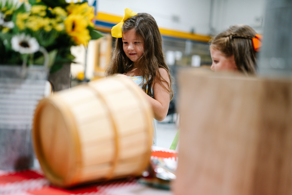 two students picking west virginia grown food to take home. 