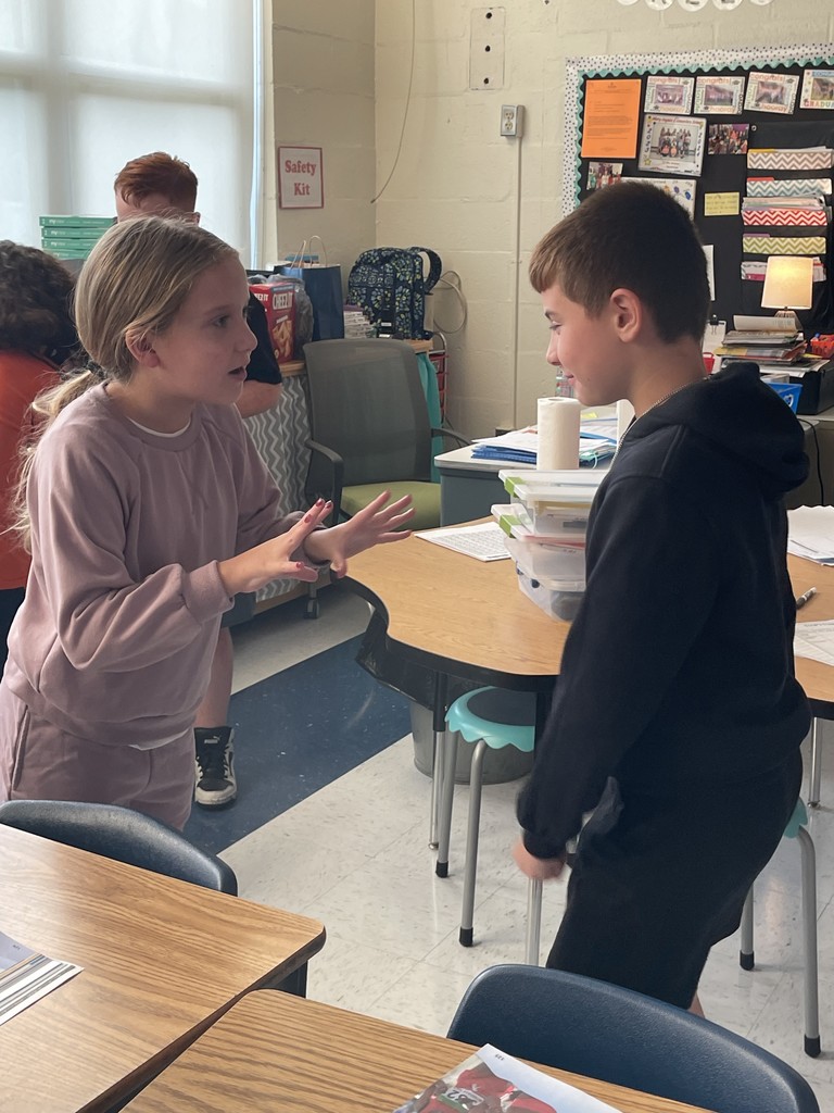 two students discussing a question during the lesson.