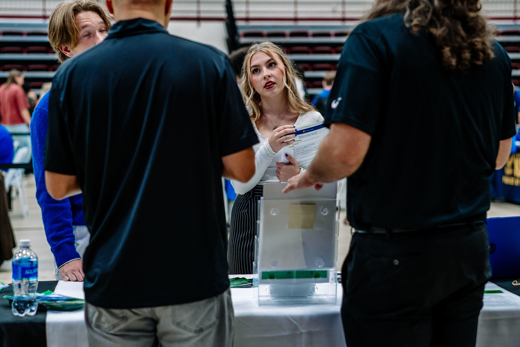 a student listens in as reps from marshall university discuss what options are available at the school. 