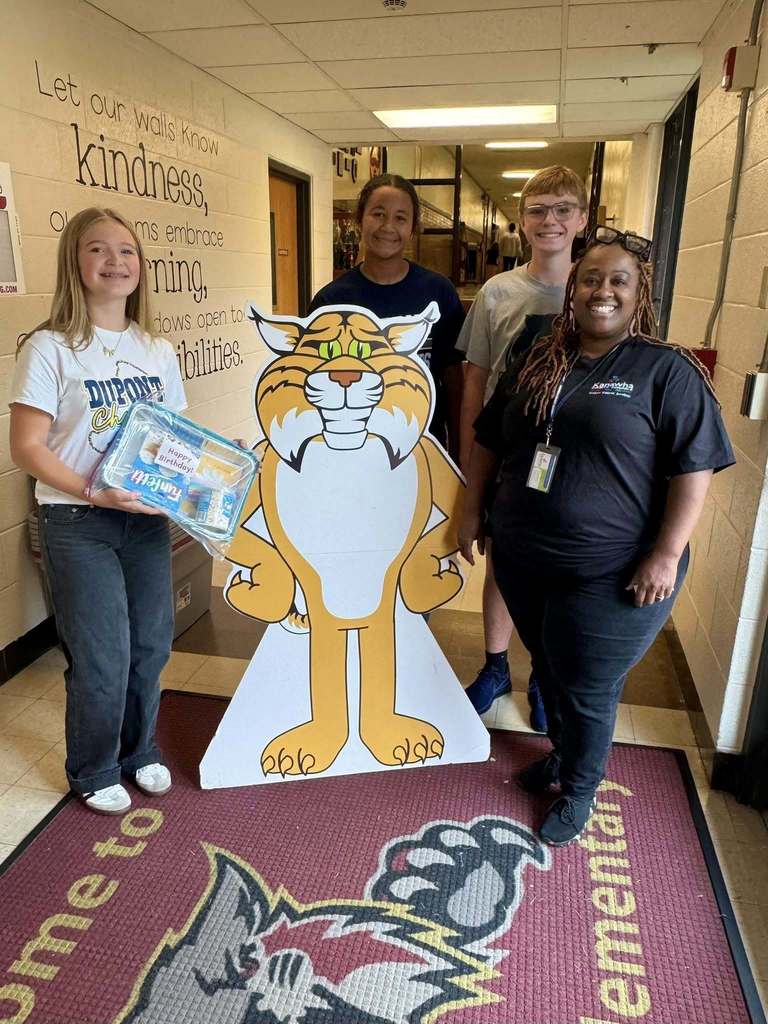 DuPont middle school students dropping off cake kits to the school in their feeder area. 