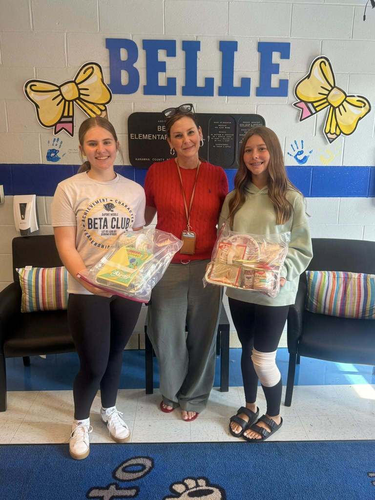 DuPont middle school students dropping off cake kits to the school in their feeder area. 