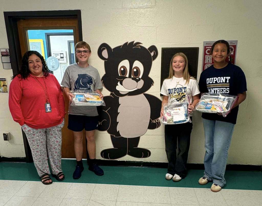 DuPont middle school students dropping off cake kits to the school in their feeder area. 