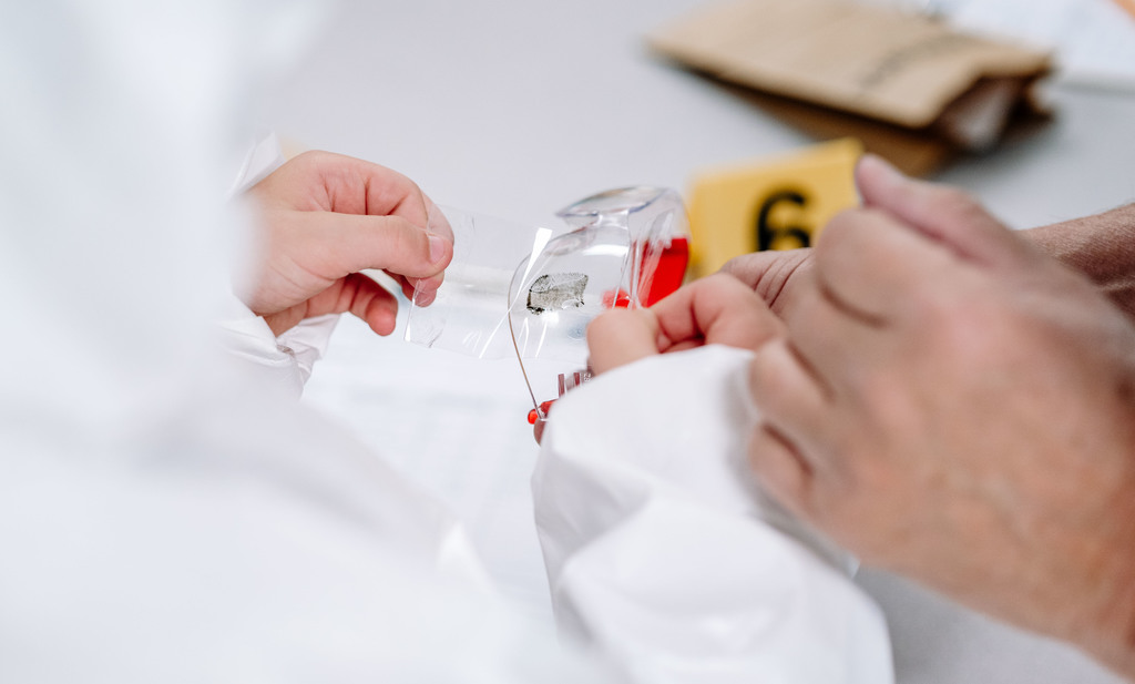 student testing for a fingerprint during the lesson.