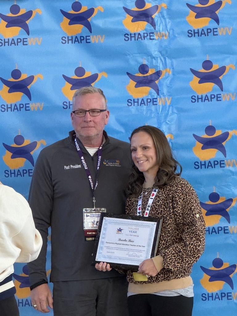 Brooke Bias, the PE teacher at Overbrook Elementary, accepting her award from ShapeWV as the elementary PE teacher of the year.