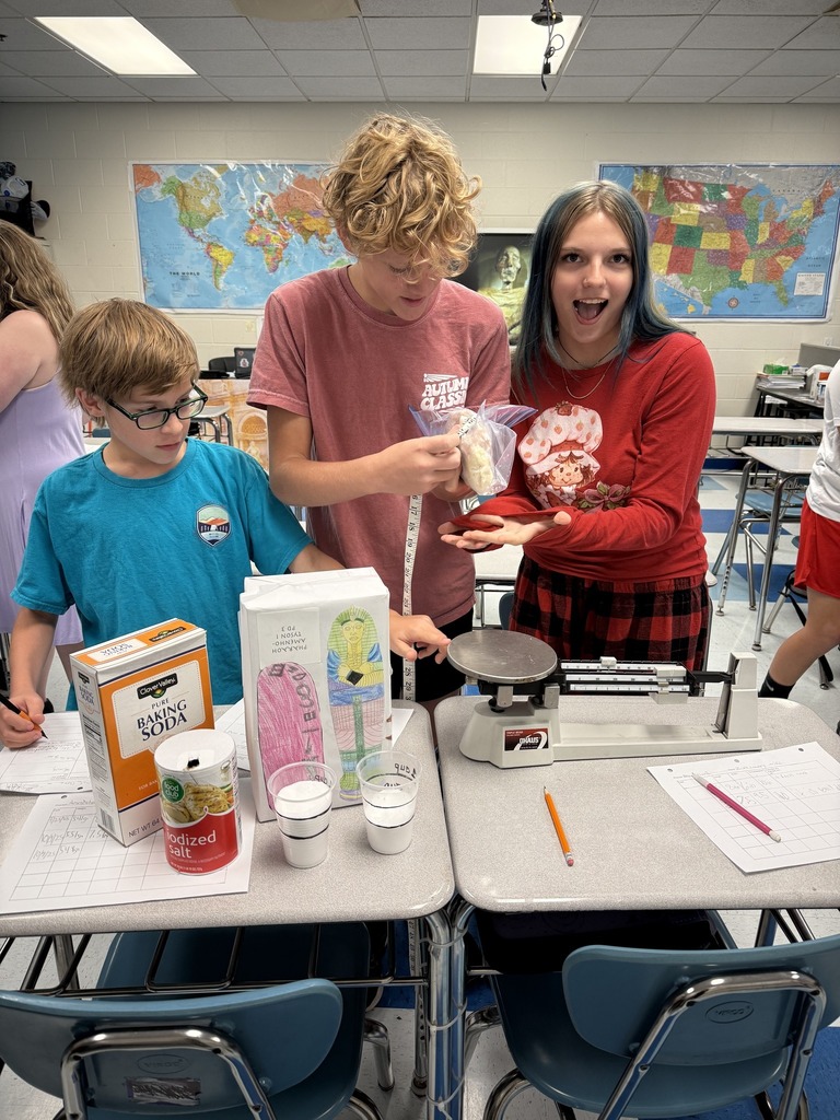 sissonville middle school students measure a chicken during a steam lab.