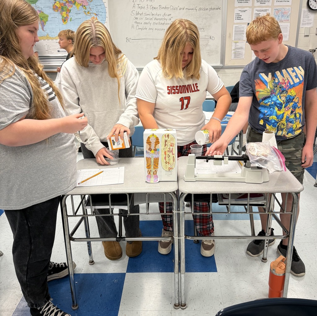 sissonville middle school students measure ingredients to create a mummy wrap for a chicken during a steam lab.