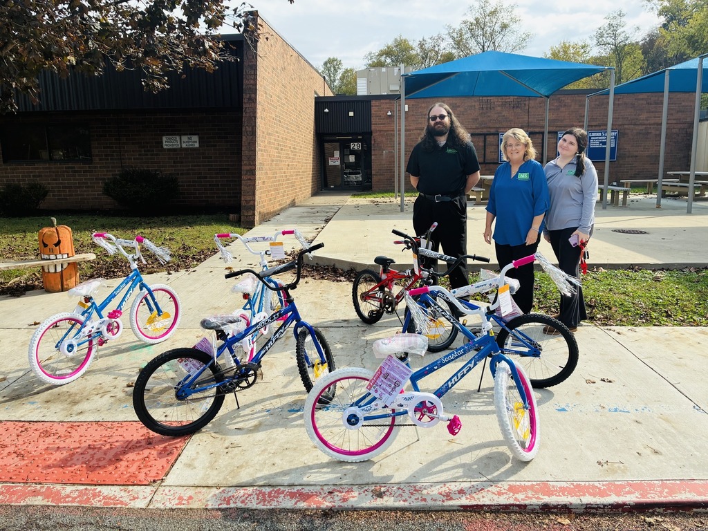 local business owners delivering new bikes to elk center elementary that are being used as prizes for good attendance.