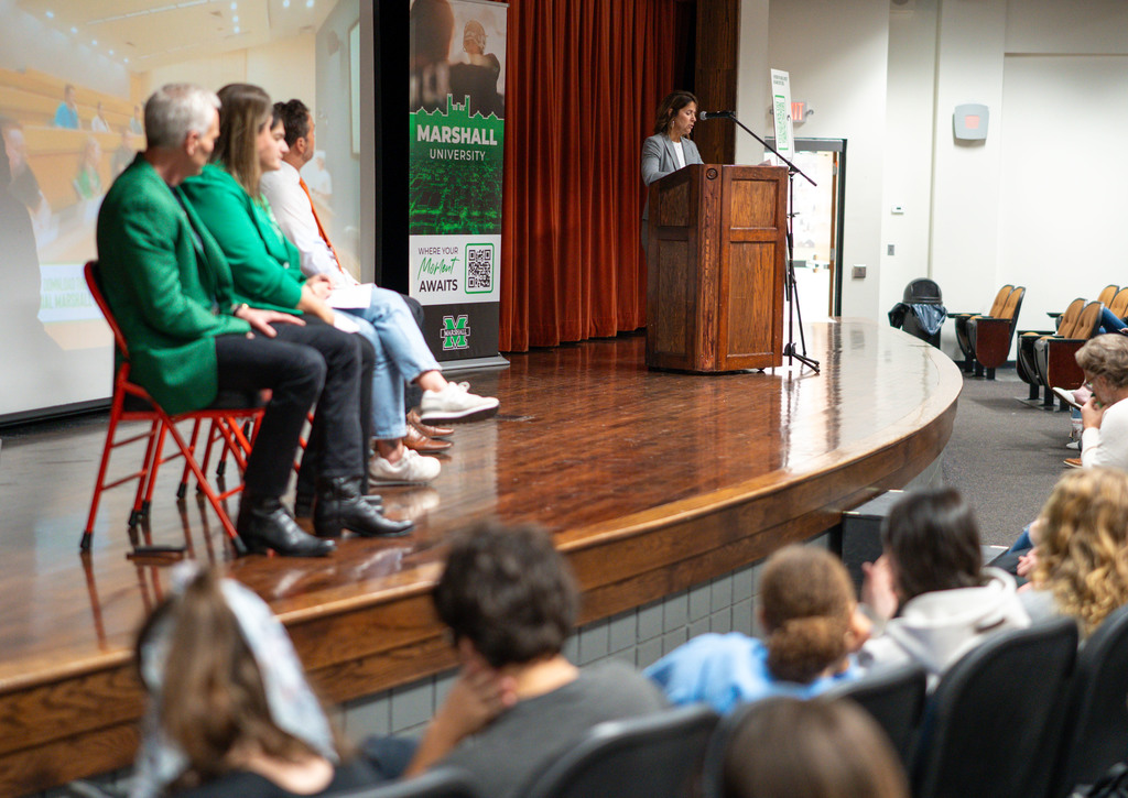 kcs superintendent, paula potter, on the stage at the south charleston high school auditorium welcoming students and guests to the event.