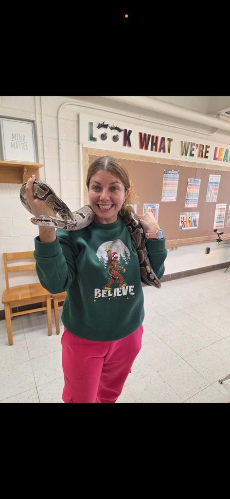 a cross lanes elementary teacher holding a snake.