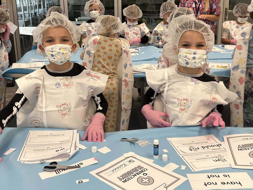 students in their surgical smiling during the lesson.