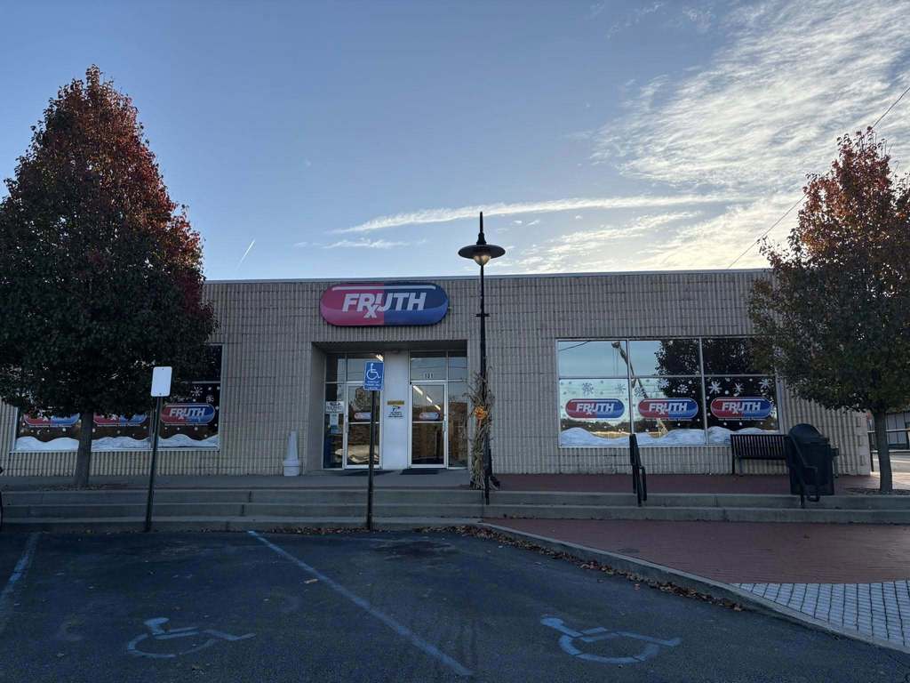 fruth pharmacy's windows painted with a snow scene by students from nitro high school.