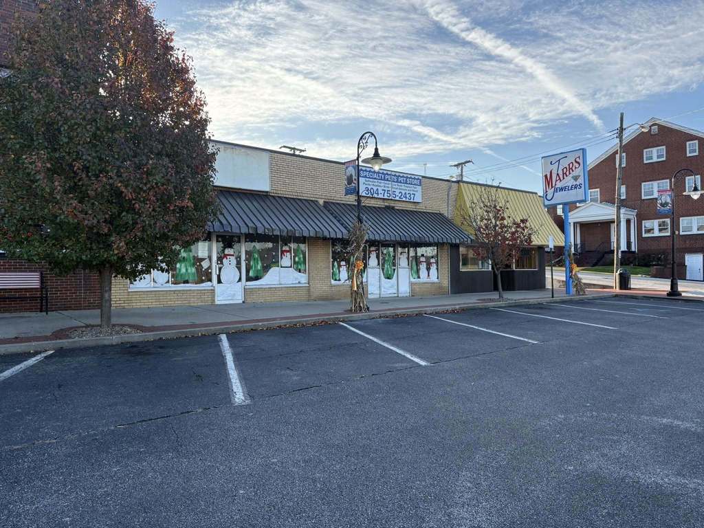 a shopping plaza in nitro with winter themed window displays painted by art students at nitro high school.