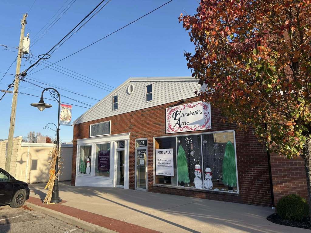 elizabeth's attic in nitro with a winter themed christmas window display painted by art students at nitro high school.