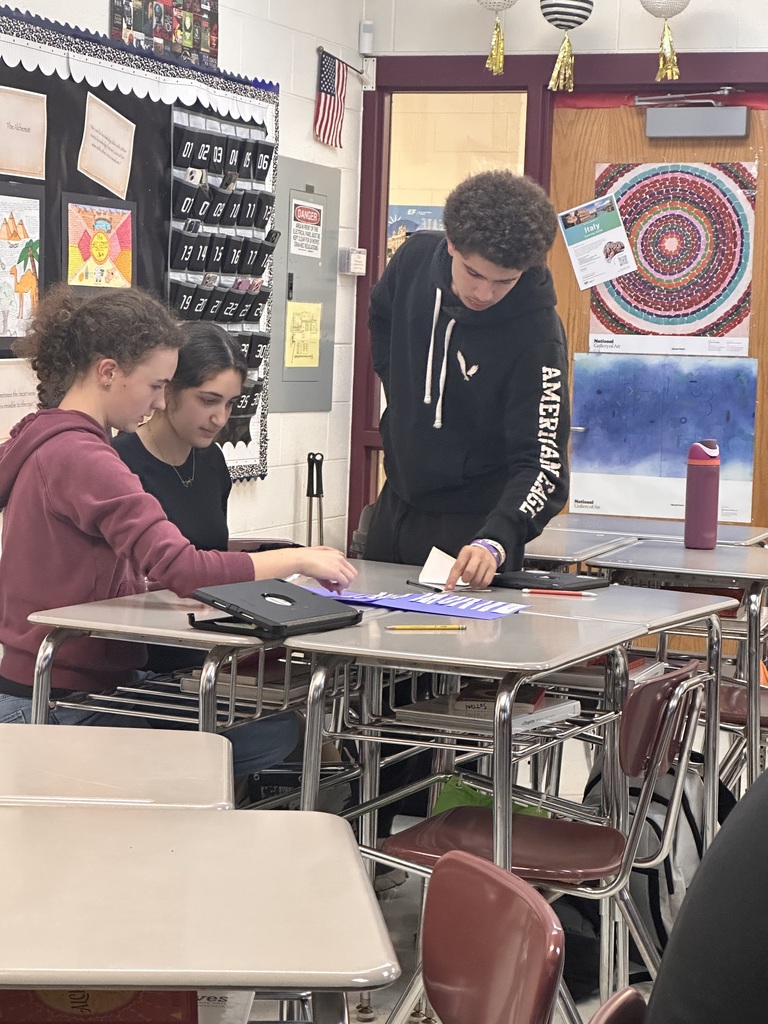 students in a group doing poetry activity