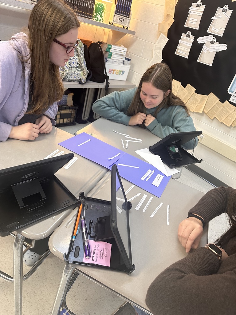 students in a group doing poetry activity