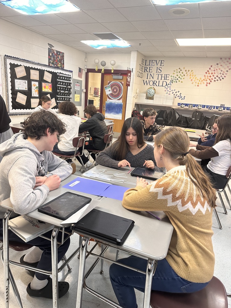 students in a group doing poetry activity